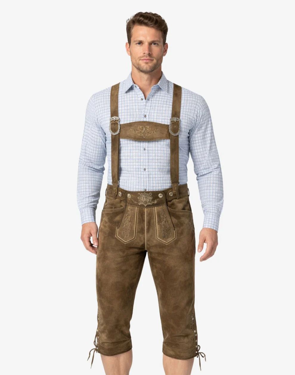 Man wearing brown leather suspenders and pants on a white background