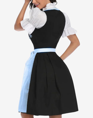 Angled front view of Bavarian dirndl dress highlighting embroidered bodice, lace trim neckline and flowing apron styling