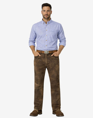 Man wearing a blue checkered shirt and brown pants on a white background