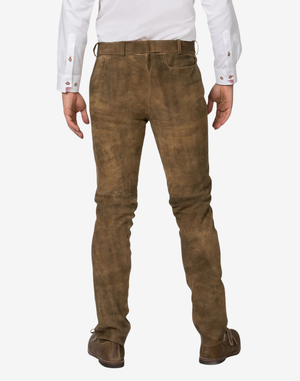 Brown leather pants worn by a person on a white background