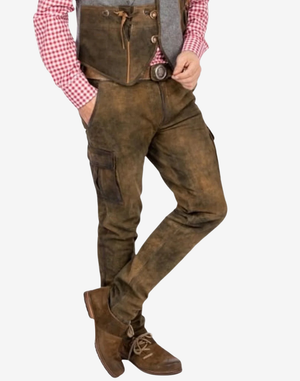 Brown leather pants with suspenders worn by a person on a white background