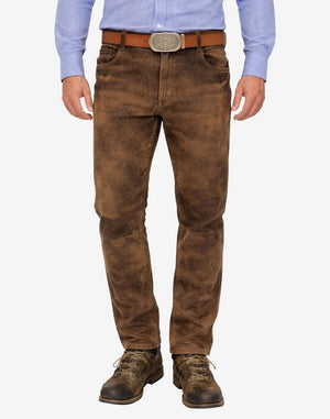 Brown leather pants worn by a person on a white background