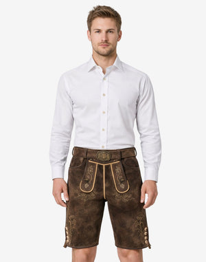 Model wearing classic alpine lederhosen for men in brown leather with traditional Bavarian embroidery and belt buckle