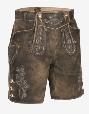 Front view of classic brown women’s Bavarian lederhosen shorts made of distressed leather, featuring traditional embroidery, decorative front flap, side pocket, and button details on the leg.
