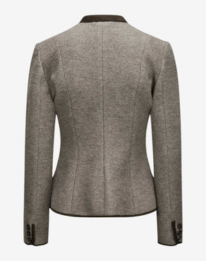 Back view of a women’s stone beige wool trachten jacket with a stand collar, fitted tailored seams, long sleeves with buttoned cuffs, and a classic Alpine heritage design.