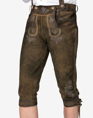 Model wearing classic Oktoberfest bundhosen showing front embroidery, leather texture and traditional Bavarian styling