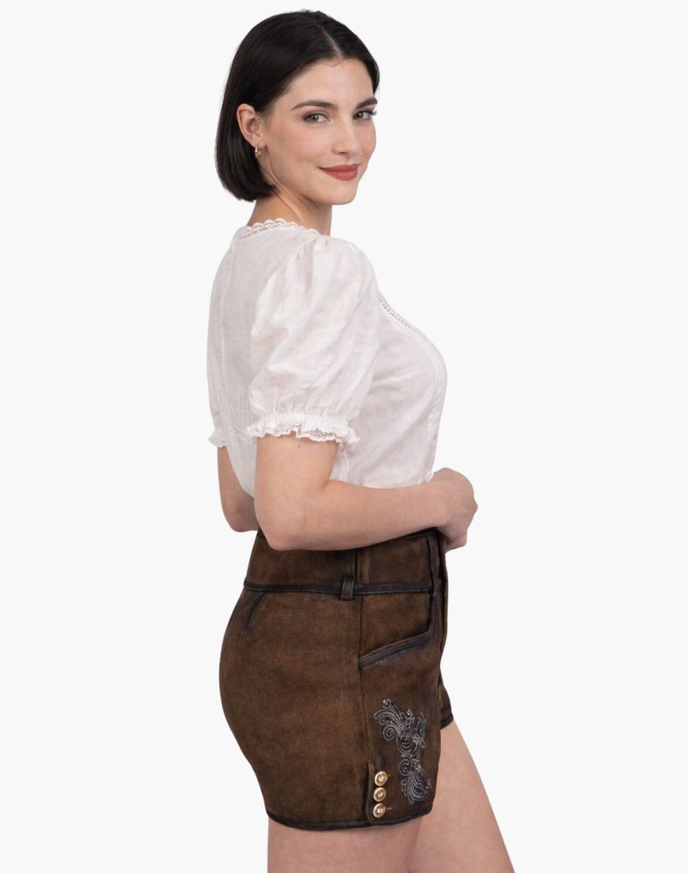 Woman wearing a white blouse and brown shorts on a white background