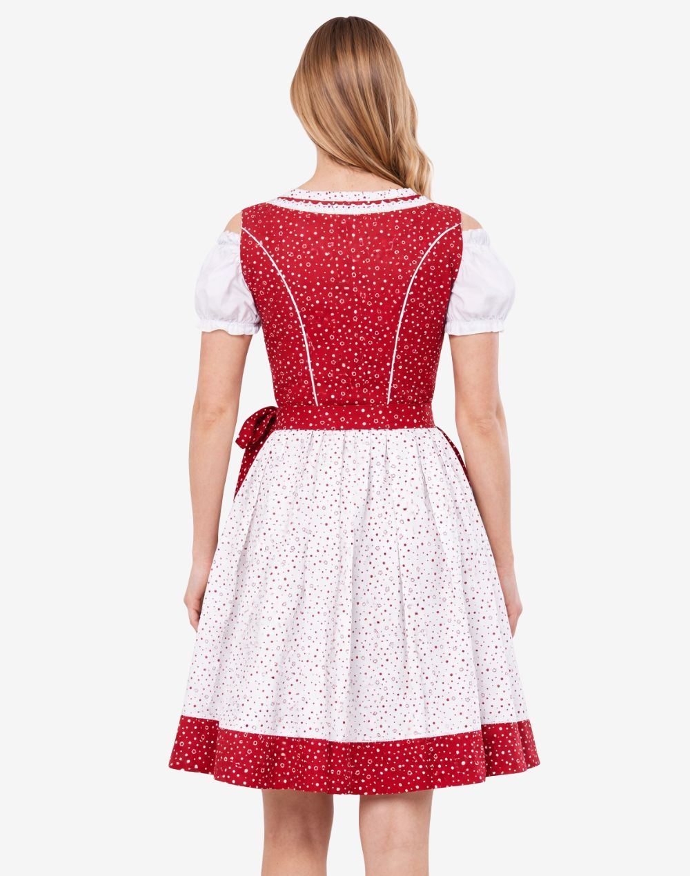 Back view of festival ready dirndl dress worn by model showing waist apron tie, structured bodice and traditional silhouette