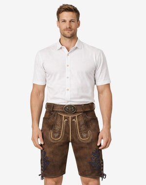 Front view of model wearing Folk Fest Lederhosen for Men in brown leather with Bavarian embroidery and traditional belt buckle