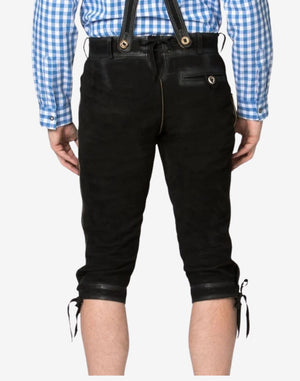 Rear view of black genuine leather Bundhosen displaying a buttoned back pocket, suspenders attachment buttons, and adjustable lace-up knee openings.
