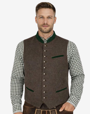 Front view of model wearing German Oktoberfest Vest for Men in brown tweed with green trim and metal buttons