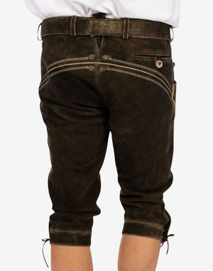 Rear wearing view of handmade Bavarian bundhosen showing fitted back structure, waistband detail and traditional alpine leather styling