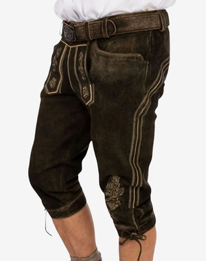 Front angled view of handmade Bavarian bundhosen displaying traditional flap design, embroidery details and authentic leather texture