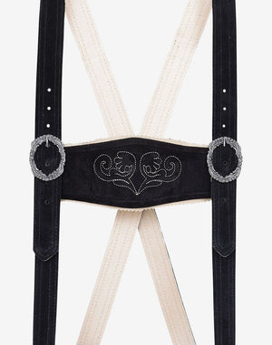 Close-up of men’s bundhosen suspenders with embroidered chest strap and decorative buckles