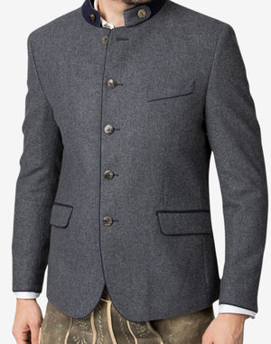 Front portrait of model wearing Bavarian festival jacket showing traditional buttons, wool texture and classic alpine design.