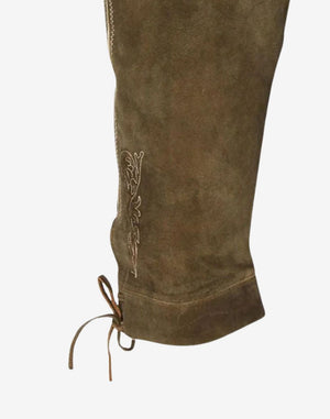 Side view highlighting leather texture, embroidered leg pattern and adjustable knee ties on traditional Bavarian bundhosen