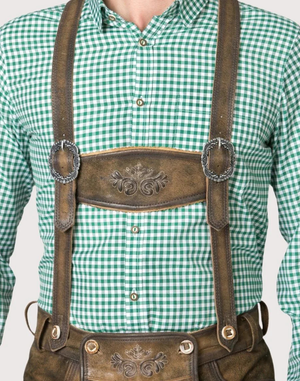 Close-up showing suspenders and chest bib with embossed pattern and metal ring hardware