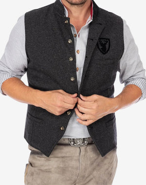 Model wearing mens traditional alpine vest displaying fitted silhouette, classic buttons and traditional Bavarian outfit styling