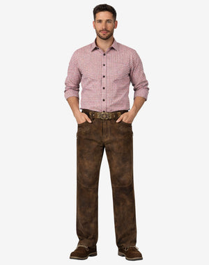 Man wearing a red checkered shirt and brown pants on a white background