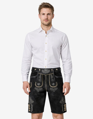 Model wearing premium alpine lederhosen for men in black leather with traditional Bavarian embroidery and belt