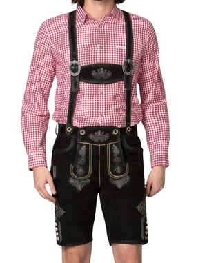 Black alpine lederhosen with suspenders on model shows traditional bib strap hardware and silver embroidery accents