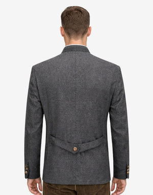 Back view of model wearing Premium Trachten Jacket for Men showing tailored alpine fit with rear strap detail