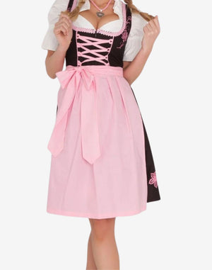 Front close view of model wearing rustic German dirndl dress showing lace blouse, corset lacing and pink apron waist tie