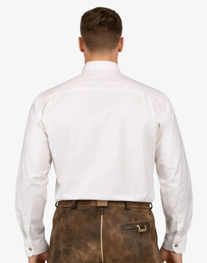 Man wearing a white dress shirt and brown leather pants on a white background