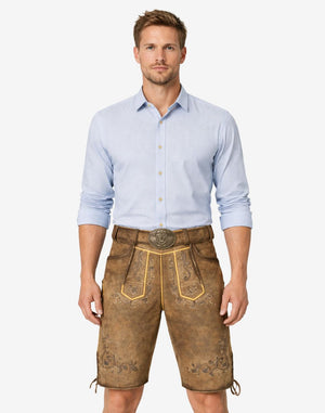 Model wearing Trachten classic lederhosen for men in brown leather with traditional Bavarian embroidery