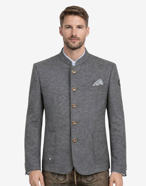 Model wearing traditional alpine jacket for men front view featuring gray wool fabric, horn style buttons and classic Bavarian design.