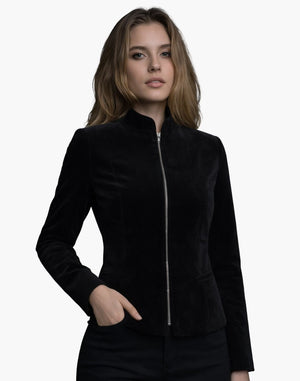 Female model wearing a black velvet jacket with a high collar and front zipper, featuring a sleek tailored fit.