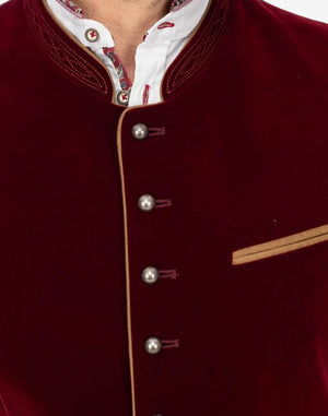 Close up of traditional Alpine vest for men showing horn buttons, textured wool fabric and classic Bavarian craftsmanship.