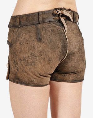 Back view of brown women’s Bavarian-inspired suede lederhosen shorts featuring a distressed finish, fitted waistband, belt loops, and adjustable back lace detail.