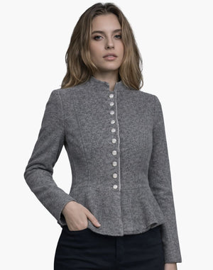 Woman wearing a gray blazer with a white background