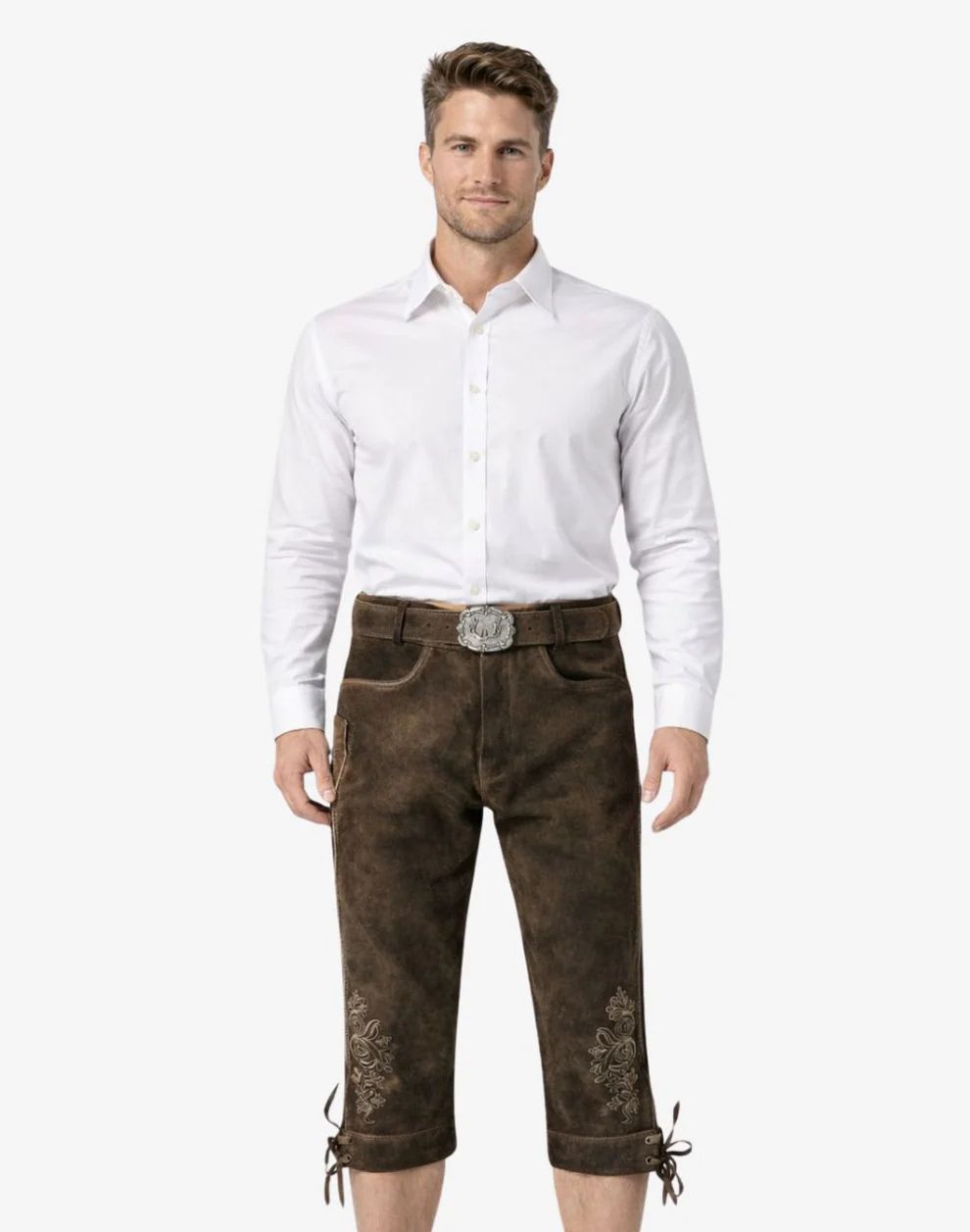 Man wearing a white shirt and brown pants with embroidery on a white background