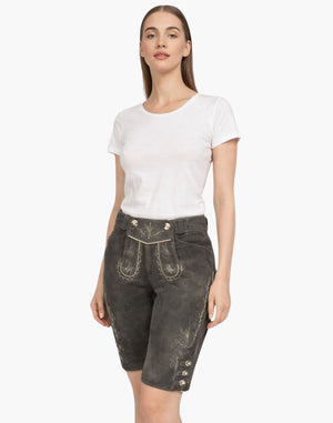 Woman wearing a white t-shirt and dark denim shorts on a white background