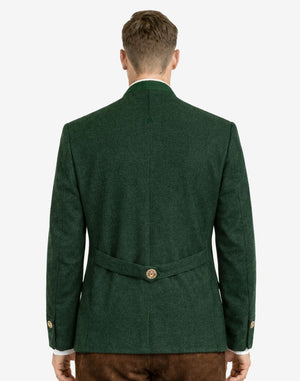 Back view of alpine green wool men’s Trachten jacket on model, showcasing tailored Bavarian fit, structured silhouette, and decorative back belt detail.