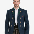 Front view of Alpine heritage men’s blue wool jacket featuring traditional Bavarian Trachten design, green collar accents, decorative metal buttons, tailored fit, and classic Oktoberfest styling with lederhosen.