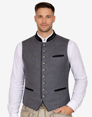 Male model wearing Alpine style wool vest for men paired with traditional Bavarian attire, ideal for Oktoberfest and cultural occasions.