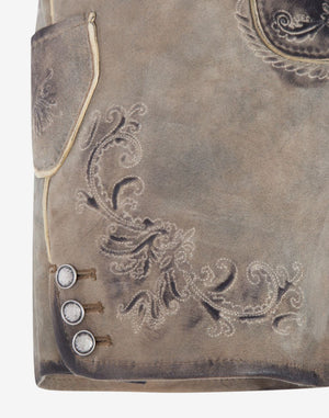 Close-up of light grey suede lederhosen shorts showing traditional Bavarian floral embroidery, side pocket detail, and decorative metal buttons with vintage-style finish.