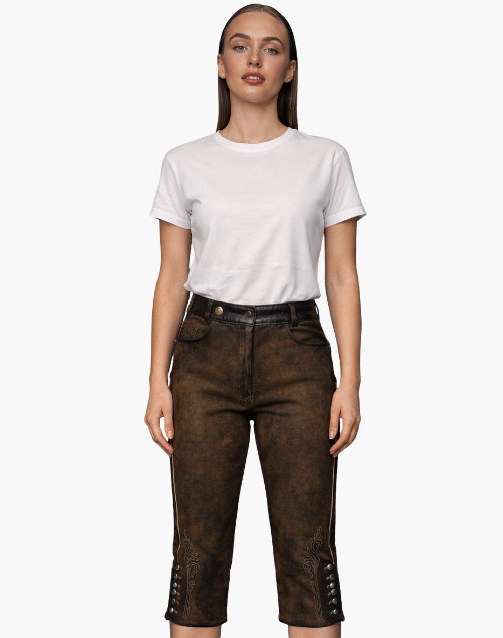 Woman wearing a white t-shirt and brown leather pants on a white background