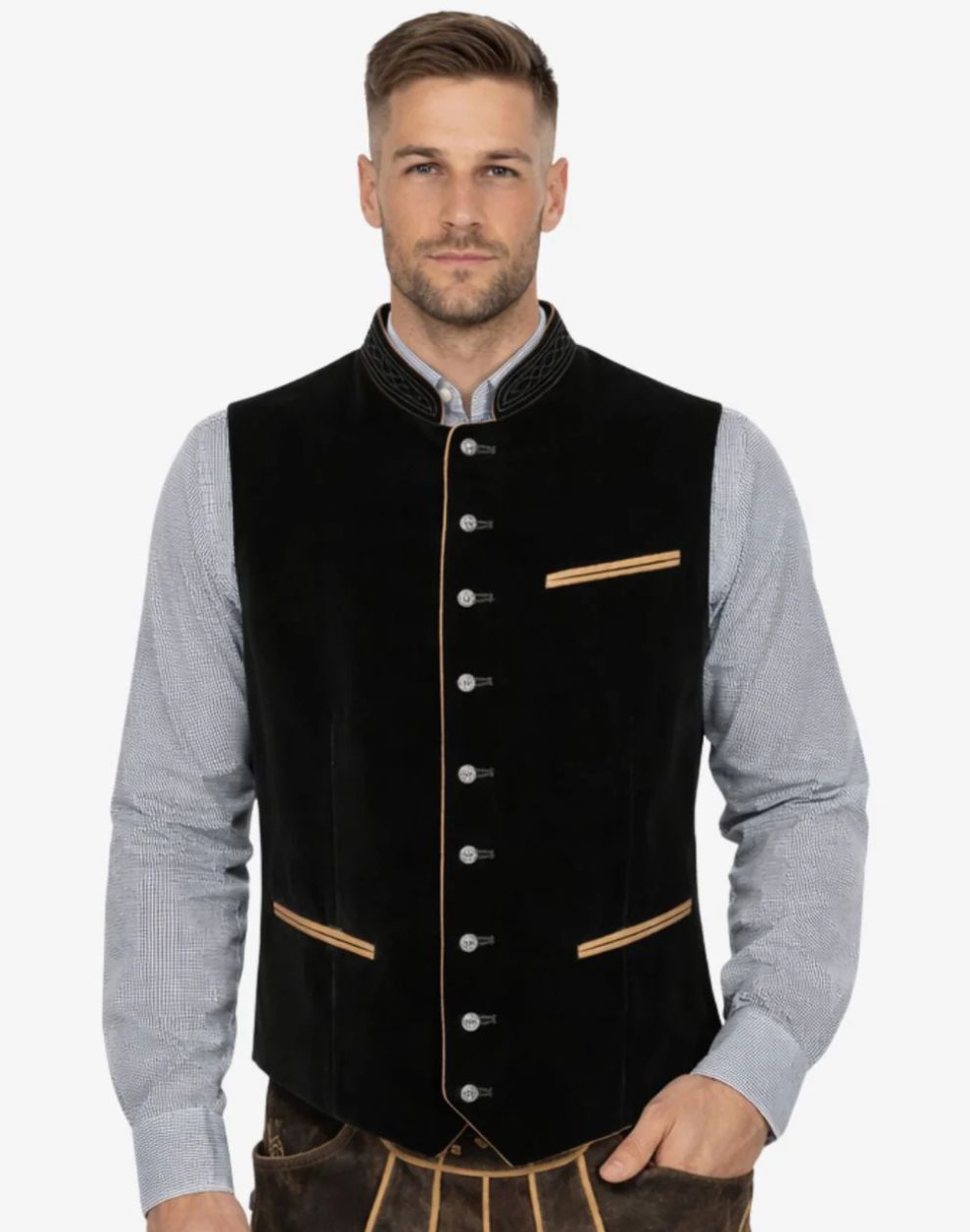 Man wearing a black vest with gold accents on a white background