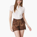 Woman wearing a white blouse and brown shorts on a white background