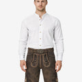 Model wearing authentic German lederhosen for men in brown leather with traditional Bavarian embroidery
