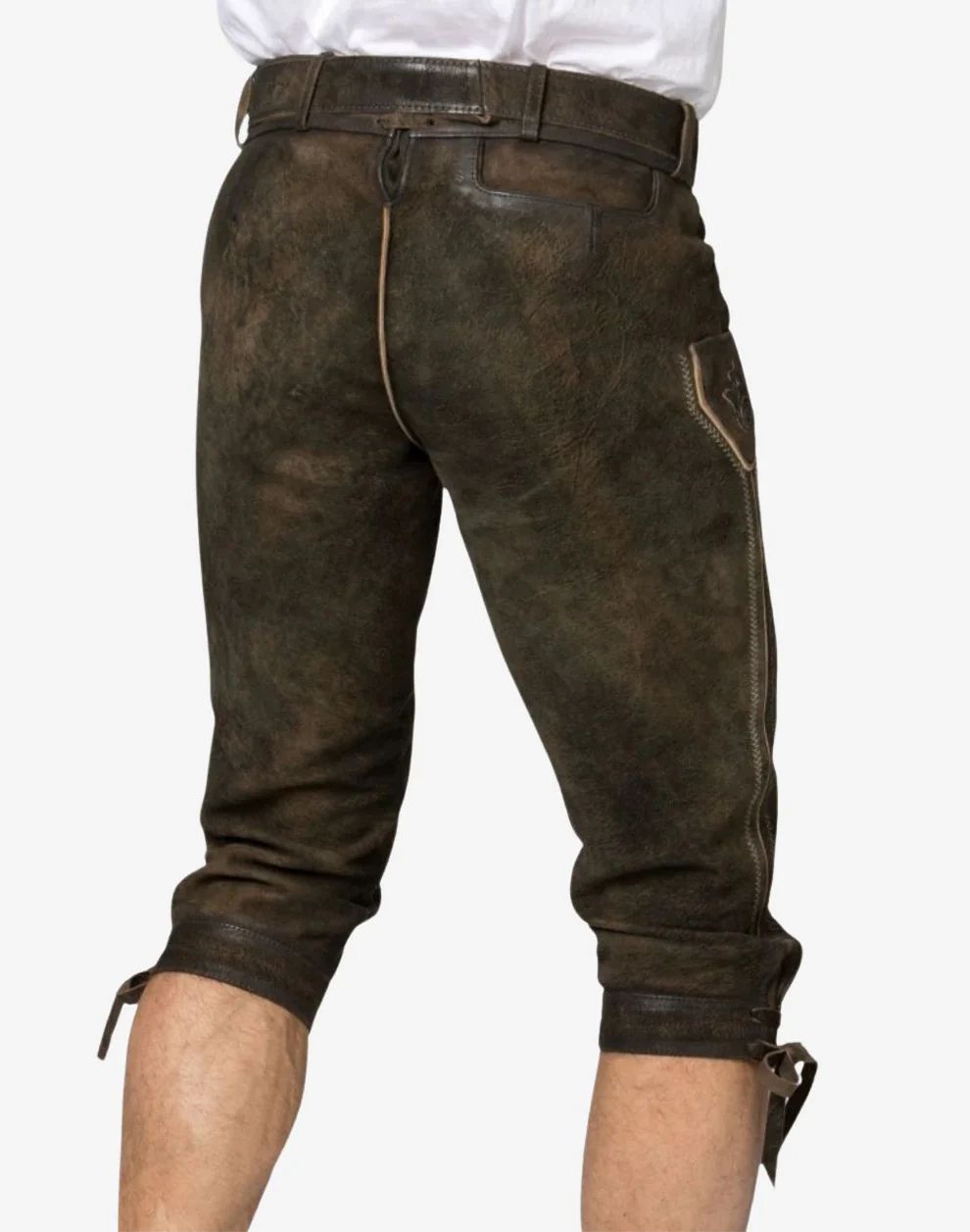 Brown leather pants worn by a person on a white background