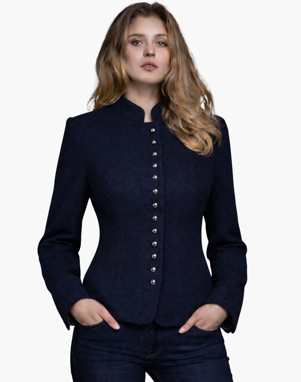 Woman wearing a navy blue Bavarian-style Trachten jacket with decorative buttons, high collar, and a fitted tailored design, paired with dark jeans, against a white background.
