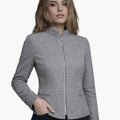 Woman wearing a gray blazer on a white background