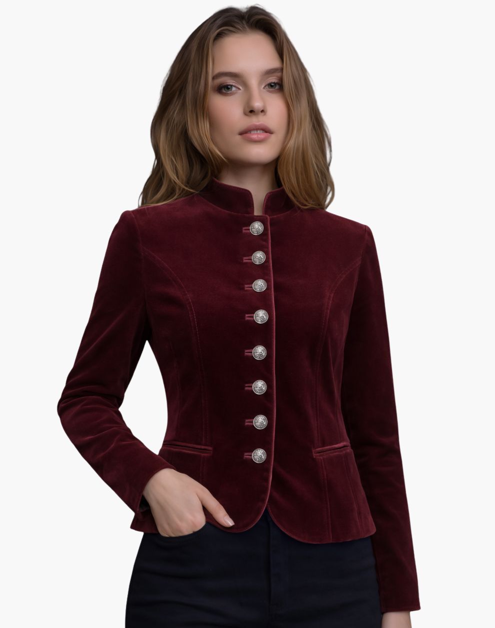 Woman wearing a burgundy velvet jacket with silver buttons on a white background