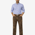 Man wearing a blue checkered shirt and brown pants on a white background