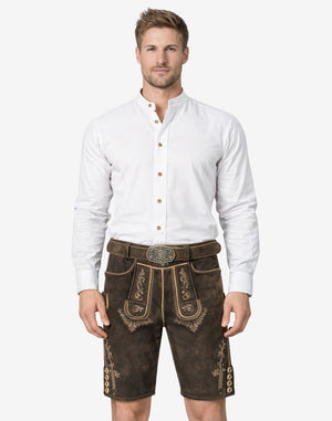Model wearing Bavaria crest lederhosen for men in dark brown leather with traditional Bavarian embroidery